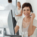 Girl working at computer with headphones