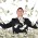 A man stands in the middle of a pile of dollars