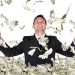 A man stands in the middle of a pile of dollars
