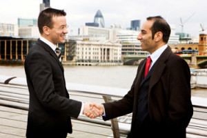 Two business men shacking their hands as conclusion of a deal