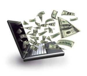 Make Money Online Dollar banknotes sorting out from a laptop screen