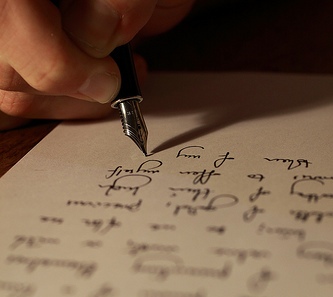 An hand writing on a paper