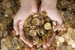 Two hands full of coins