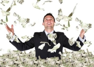 A man stands in the middle of a pile of dollars