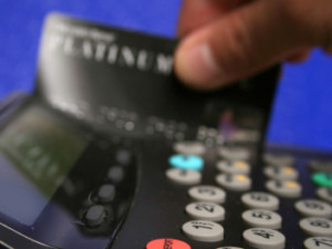 Hand swiping credit card