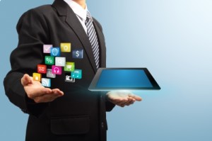 Tablet With Application Icons In The Hands Of Businessmen